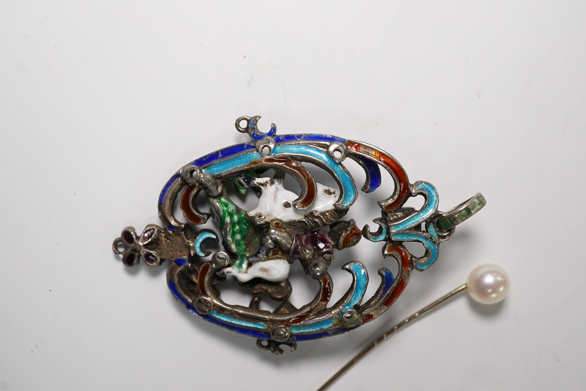 An Austro-Hungarian? white metal and polychrome enamel set St. George & the Dragon, drop pendant, 55mm and two stick pins. Condition - poor to fair